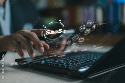 Business professional using SaaS platform on digital device, representing cloud computing technology, online software services, automation, productivity, and modern scalable business solutions.