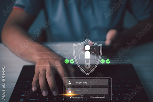 User entering login credentials on secure digital interface with shield icon,representing data protection,authentication,privacy control,cybersecurity system,modern business security technology.