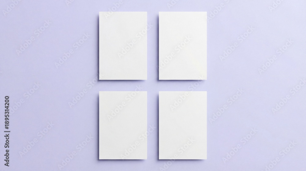 Fototapeta premium Four blank white business card mockups on soft purple background