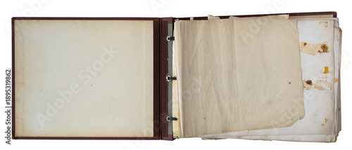 Quadro su tela Open vintage photo album with blank aged pages and binder rings, isolated on whi