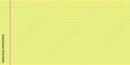 Close up of yellow lined notebook paper with a red margin
