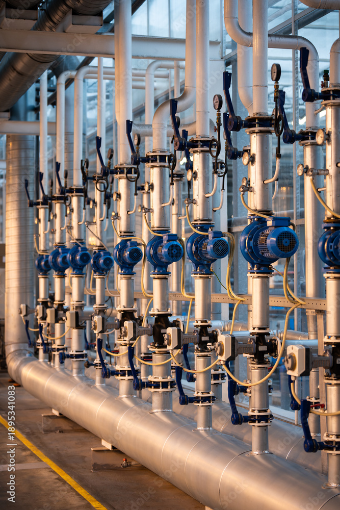 Fototapeta premium High-tech agricultural greenhouse infrastructure with water distribution pipes automated control systems. Advanced hydroponic greenhouse engineering with industrial communication, pumps, valve network