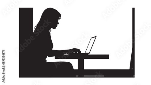 Woman working on laptop at desk in a focused and productive office environment from a side viewpoint