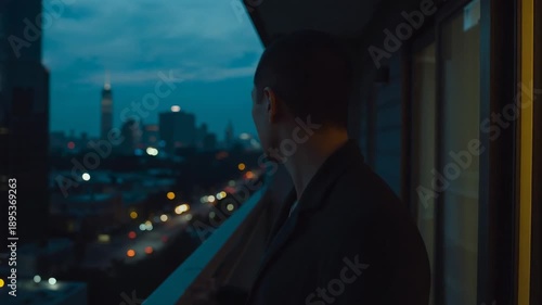 Wallpaper Mural Standing man in dark coat closing eyes, turning toward skyline from balcony railing, copy space Torontodigital.ca