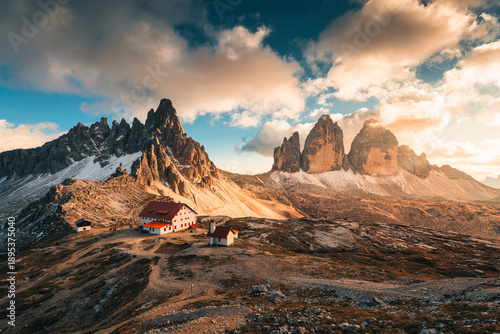 Scenic view of Tre Cime di Lavaredo peaks and mountain hut in the sunset at Dolomites, italy