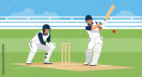 Cricket players in action on a green field with a blue sky and white fencing during a match.