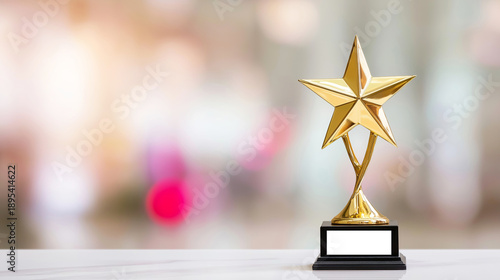 Golden star award representing success, achievement, excellence, and winning a prize on a white marble surface