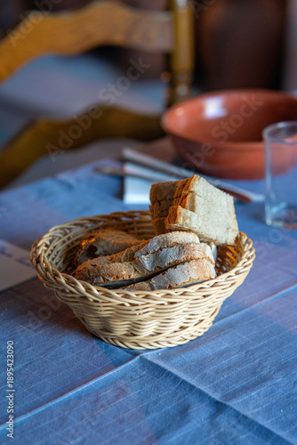 Traditional Alentejo bread served on a rustic table in a typical Portuguese restaurant, representing local cuisine, culture and authentic Mediterranean food experience.