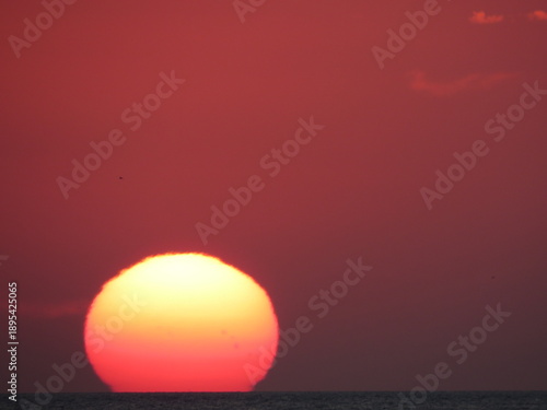 Photos Sunset sun dipping below horizon