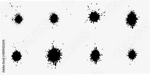 Abstract ink blots on a white background resembling scattered patterns