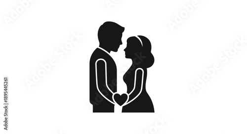 Silhouettes of a couple embracing holding a heart shape between them