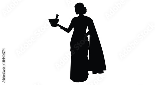 Silhouette of a woman in traditional indian attire holding a bowl