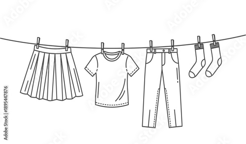 Clothing items hanging on a clothesline with clips, including a pleated skirt, tshirt, jeans, and socks