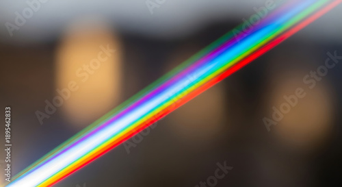 A blurry image of a rainbow colored diagonal line