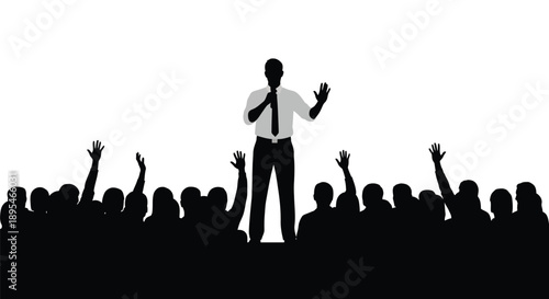 Speaker addressing a crowd with raised hands a striking silhouette