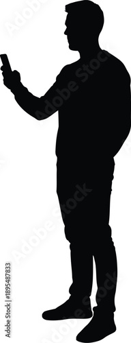 A silhouette of a man standing and holding a smartphone in his right hand