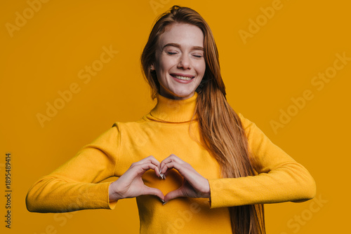 Individual expressing kindness through gesture with cheerful environment