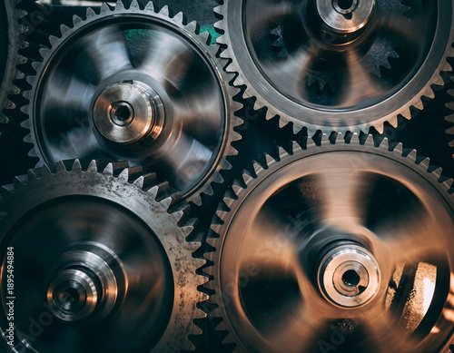 Industrial machines utilize interconnected gears to transform rotary power, manage velocity, and sustain stable mechanical functioning. Enhanced with cinematic color grading and natural irregular illu