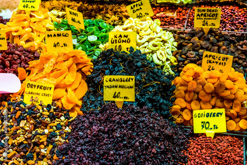 Colorful assortment of dried fruits and berries at market stall
