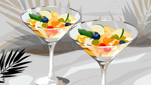 Tropical cocktail served in an elegant glass, decorated with fruit and leaves.