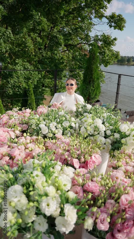 custom made wallpaper toronto digitalElegant woman standing among lush flowers. Concept of woman with flowers.
