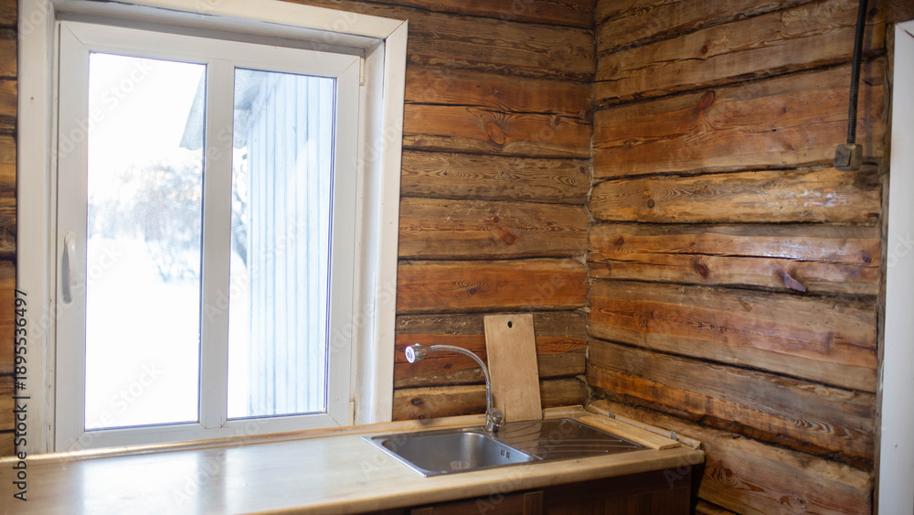 Obraz premium a wooden beam wall in the kitchen