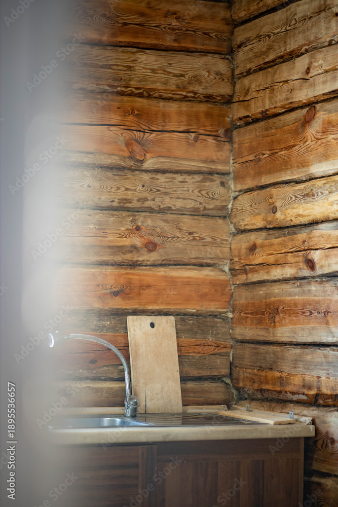 Fototapeta premium a wooden beam wall in the kitchen