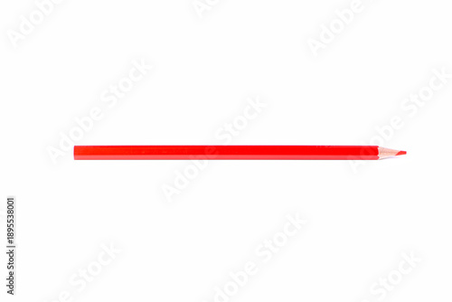 Single red wooden pencil with sharpened tip placed horizontally, isolated on white background. Minimal composition with copy space for creativity, design, and education concepts.