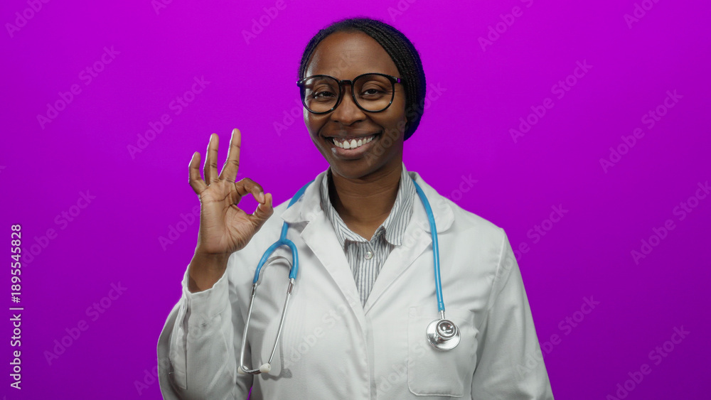 © Krakenimages.com - Doctor smiling woman black female professional medical stethoscope labcoat glasses pink background healthcare adult isolated happy adult © Krakenimages.com - Doctor smiling woman black female professional medical stethoscope labcoat glasses pink background healthcare adult isolated happy adult