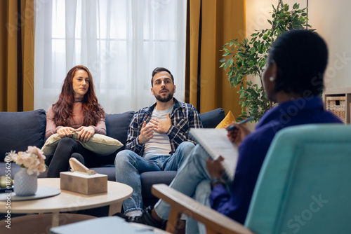 Couple discussing relationship problems during psychotherapy session