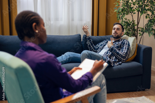 Photos Man talking to therapist during psychotherapy session