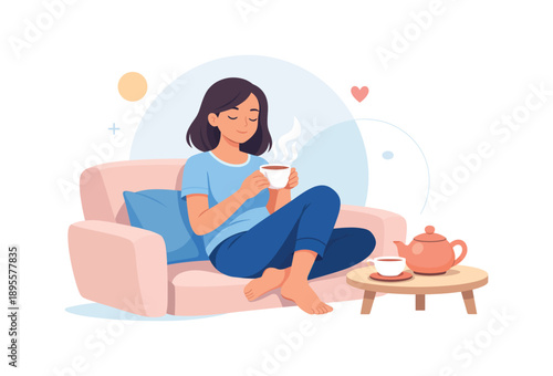 Relaxed woman enjoying tea on couch in cozy living room setting