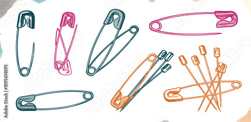 Assorted safety pins arranged in a cluster on a white surface from a top-down viewpoint