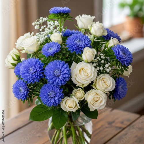 Elegant Bouquet of White Roses and Blue Flowers in Vase.