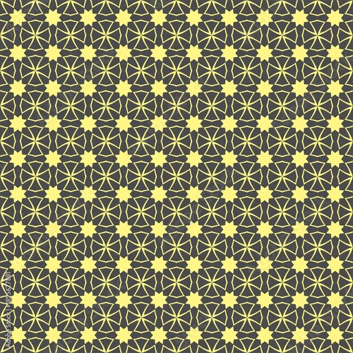 Geometric floral print in yellow on a black background.