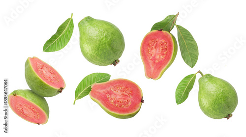Schilderij op canvas arrangement of fresh pink guavas, whole and halved, with green leaves, isolated on black