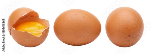 Tableau sur toile three brown chicken eggs arranged in a row: one cracked open revealing its bright yellow yolk, one whole, and one with shell fragments scattered