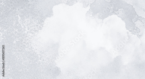Abstract watercolor background with soft gray and white textures.