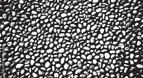 A densely packed, monochrome pattern resembling poppy seeds or small pebbles
