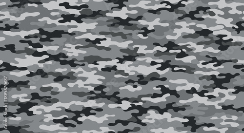 A grayscale camouflage pattern featuring irregular shapes and varying tones.