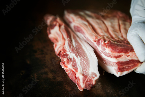 A chunk of pork belly on a cutting board