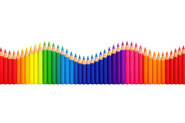 Group of many colored pencils forming a dynamic wave, showing an art and education concept with a vibrant color spectrum