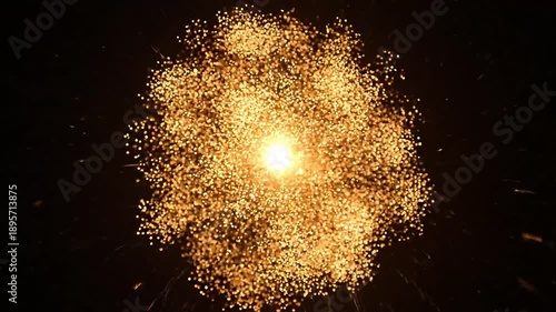 Explosion of golden sparks and light against a dark background, creating a dazzling celebratory effect.