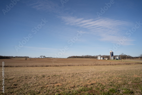 Wide open farmland in the countryside under a blue sky