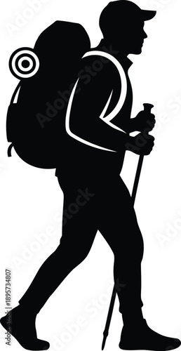 Silhouette of a male hiker carrying a backpack and using a trekking pole for an outdoor adventure
