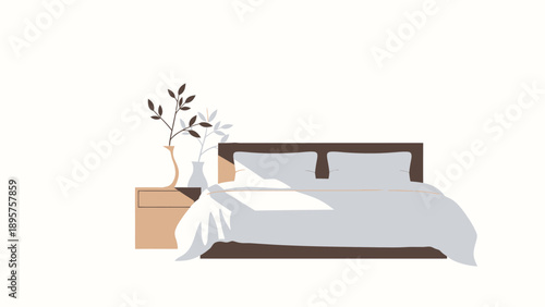 A serene bedroom scene with bed, pillows, and vase with flowers on the bedside table viewed from the side.