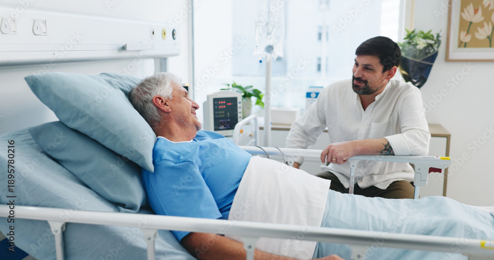 Obraz premium Senior patient, son and communication in hospital for visit, emotional support and check up for healing. Care, comfort and elderly father with man for health recovery, chat and love in medical center