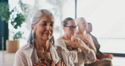 Foto Breathing, exercise and meditation with senior women in studio for balance, inner peace or mindfulness