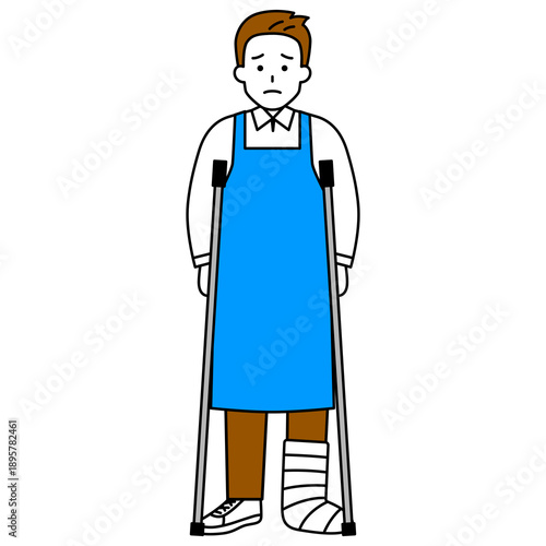 足を怪我して松葉杖をついているエプロン姿の男性