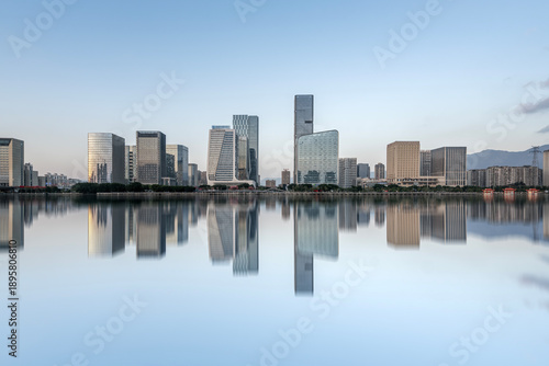 Modern City Skyline with Reflections on Water